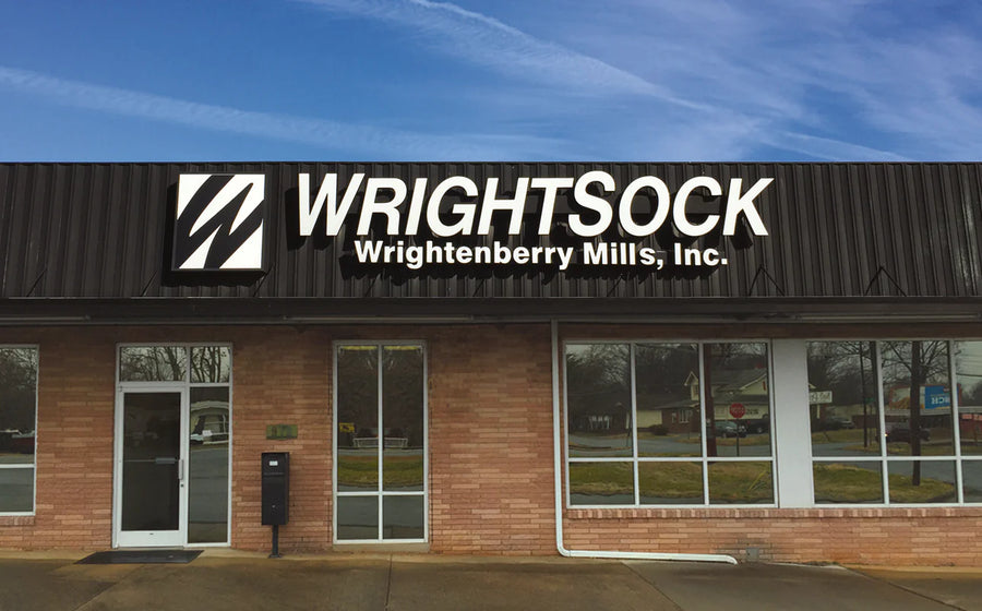 Wrightsock Wightenberry Mills, Inc. building with logo and name on a clear day